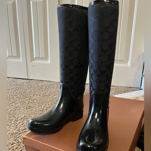 Black coach rain boots.